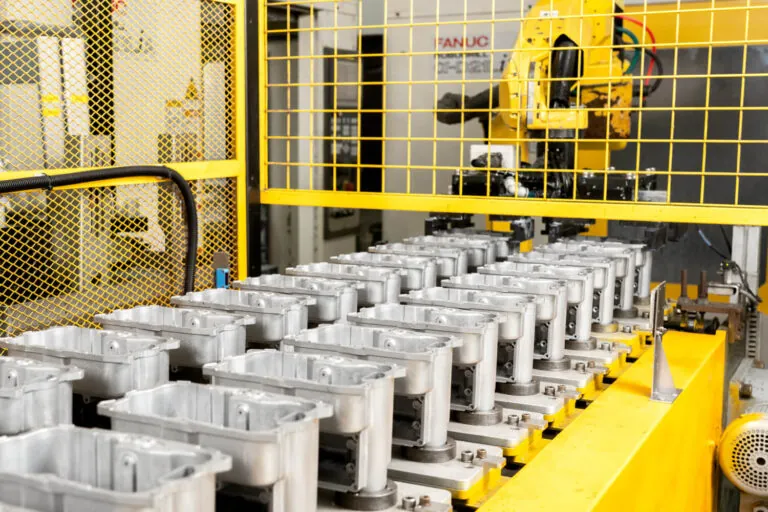 Fanuc robotic arm integrated into the automated aluminum die casting production line for precise material handling and positioning