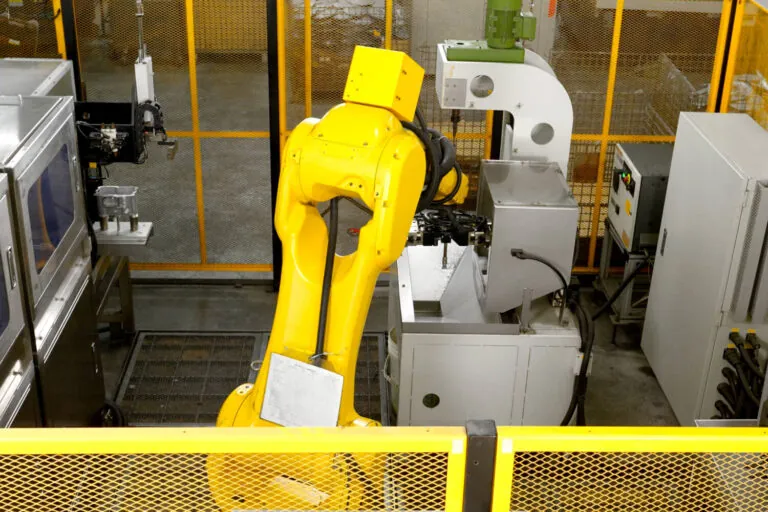 Fanuc robotic arms integrated into the automated aluminum die casting production line for precise material handling and positioning.