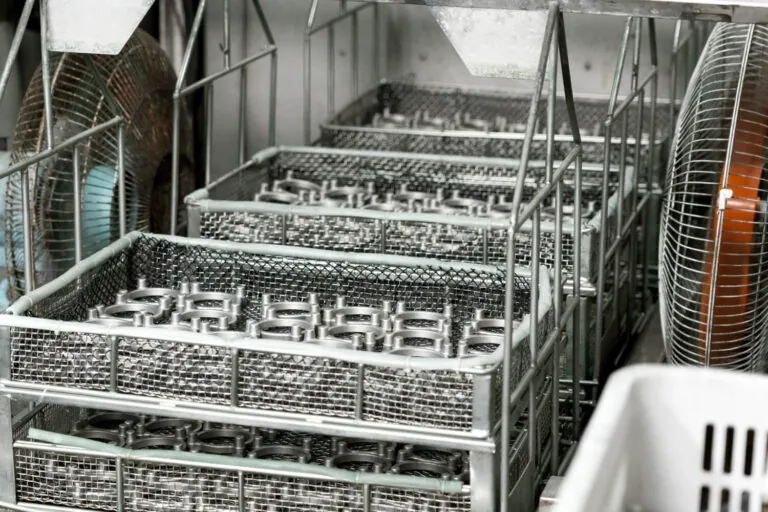 Precision aluminum die cast components moving through the vertically integrated production workflow from CNC machining to in-house surface finishing.