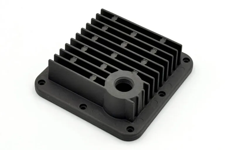 Black powder-coated aluminum die-cast heat sink housing providing enhanced emissivity and corrosion resistance for outdoor LED lighting systems.